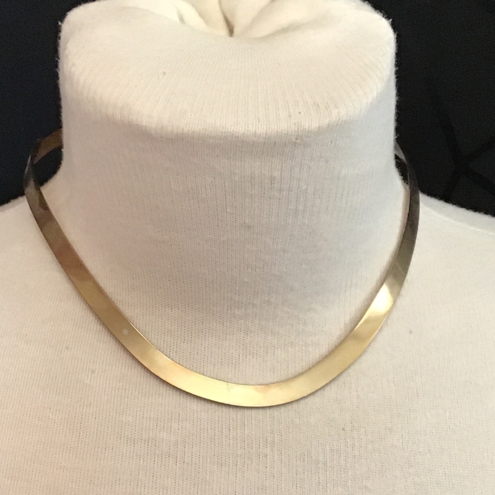 Torque choker style gold tone necklace